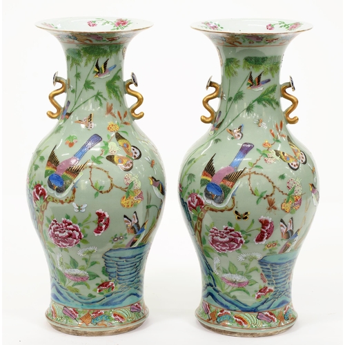 447 - A pair of Chinese celadon ground Canton famille rose vases, second half 19th c, with ruyi sceptre ha... 