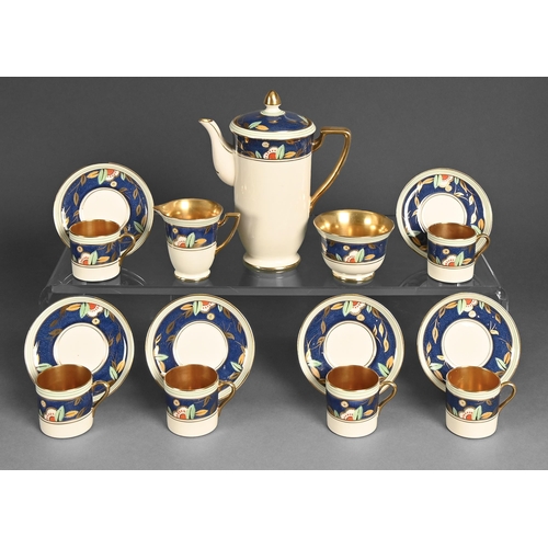 461 - A Crown Devon coffee service, c1930, painted with stylised flowers and gilt leaves atop a powder blu... 