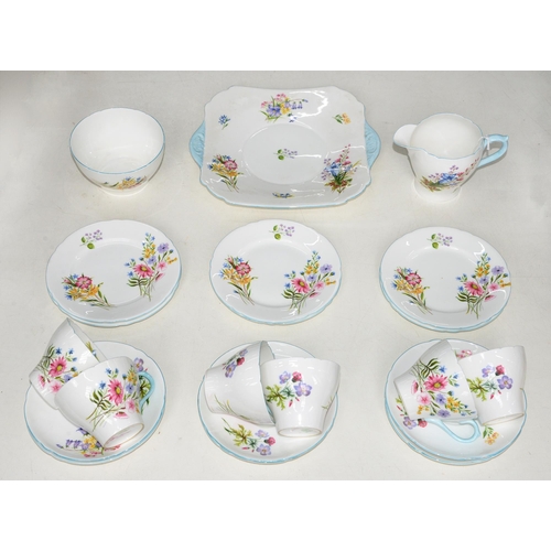 470 - A Shelley bone china tea service, c1920, decorated with flowers, two handled plate 24cm over handles... 