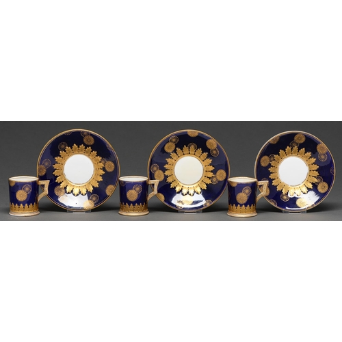 484 - A set of three Coalport cobalt ground coffee cans and saucers c.1880 with raised gilt Japanese-style... 