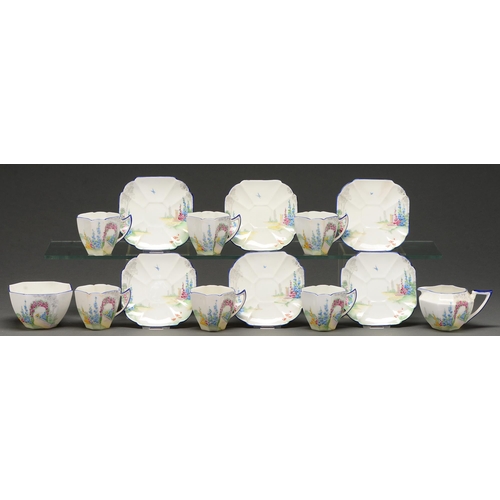 487 - A Shelley tea service, c.1930, printed and painted with a flower garden, saucer 11.5cm diam, printed... 