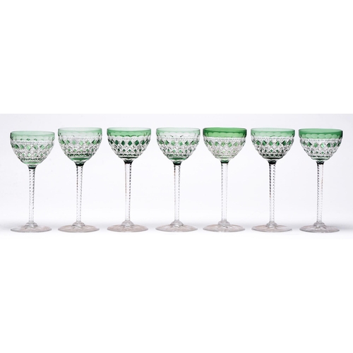 492 - Seven green flashed and cut glass hock glasses, second quarter 20th c, 19cm h and c... 