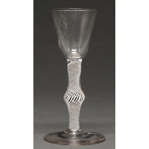 494 - A George III wine glass, c1770, the rounded funnel bowl on multiple spiral air twist stem with ... 