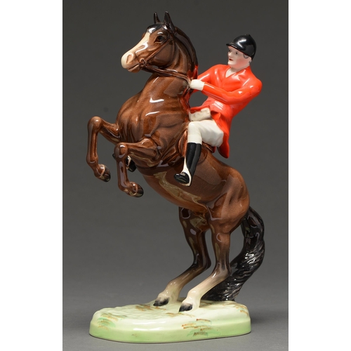 500 - A Beswick equestrian figure of huntsman on a rearing horse, 24.5cm h, printed mark