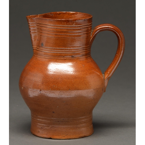 522 - A  saltglazed  brown stoneware baluster ale jug, either Midlands or North of England, 18th c, shallo... 