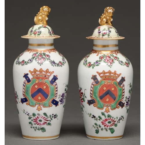 539 - A pair of French porcelain pseudo armorial vases and covers, 20th c,   decorated in Chines... 