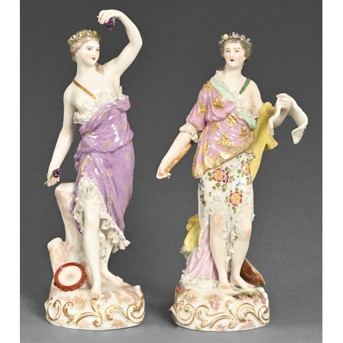 554 - A pair of Dresden figures of muses, first half of 20th century, applied with lace and gilt decoratio... 