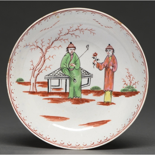 562 - A Liverpool saucer, John Pennington, c. 1770, painted in polychrome enamels with the Smoker's Valet ... 