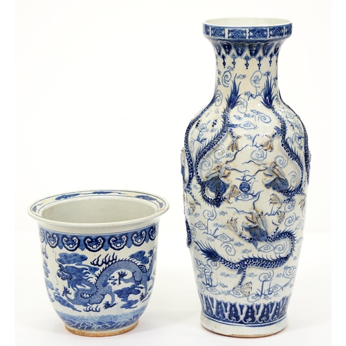 570 - A Chinese blue and white floor vase, late 20th c, moulded with dragons and a blue and white fish bow... 