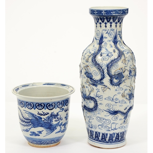 570 - A Chinese blue and white floor vase, late 20th c, moulded with dragons and a blue and white fish bow... 