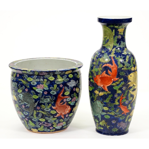 571 - A Chinese fishbowl and floor vase painted with catfish and other pond life on a cobalt blue ground, ... 