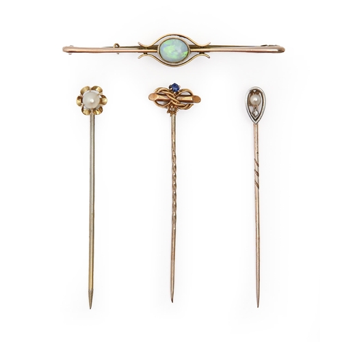 61A - Three gold stickpins, c1900, with diamond or other terminal, various lengths and an opal bar brooch,... 