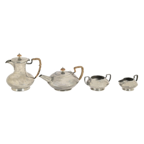 663 - Liberty & Co. A Tudric pewter four-piece tea and coffee service,  c1910, No.01324,  with turned ... 