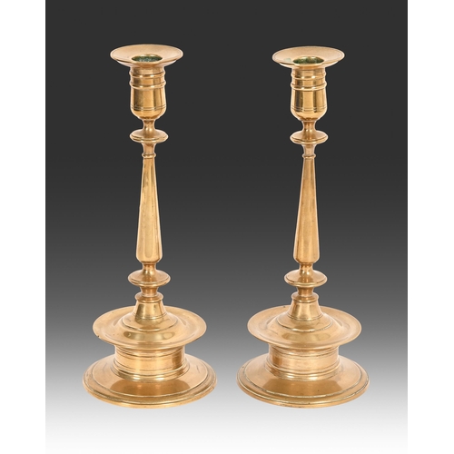 668 - A pair of Swedish turned brass Gusums Brux no.17 candlesticks, early 20th c, impressed marks, 26cm h... 