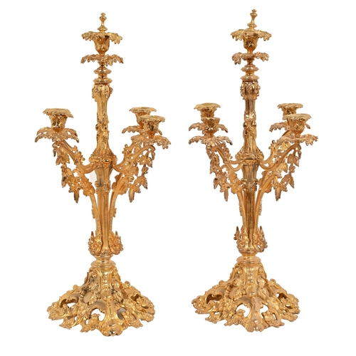 682 - A pair of 19th c style pierced giltmetal four-branch candelabra, 63cm h