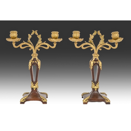 686 - A pair of giltmetal mounted mahogany twin branch candelabra, early 20th c, 34cm x 25cm... 