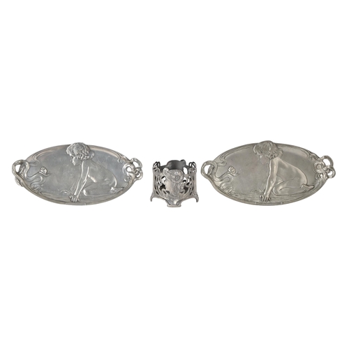 691 - A pair of art nouveau pewter trays, c1922,  with a child peering at a snail, one with impressed  mar... 