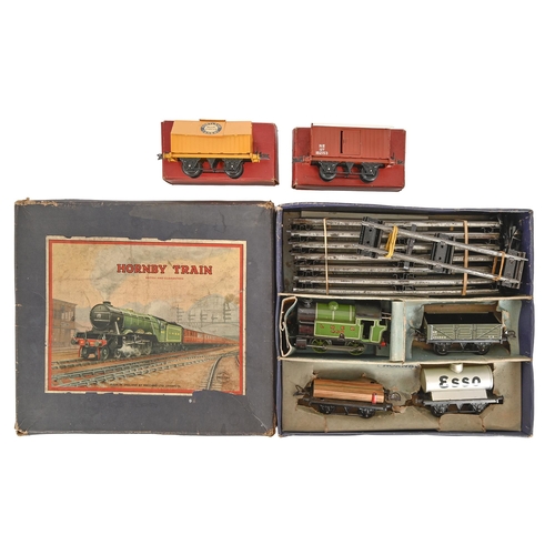 695 - A Hornby model railways. O gauge, No 201 Tank Goods Set, No 1 Goods Van and Cement Wagon, all boxed... 