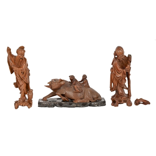 708 - A Chinese hardwood carving of children riding on a buffalo, early 20th c, on pierced wood base, 30cm... 