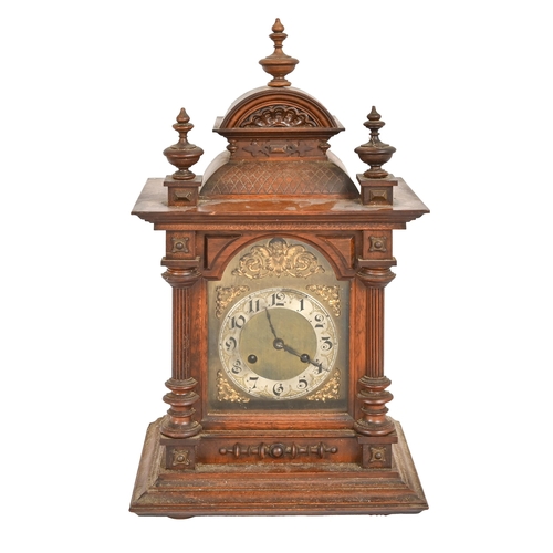 713 - A German carved walnut  bracket clock, early 20th c, brass dial with silvered chapter ring, 46cm h e... 