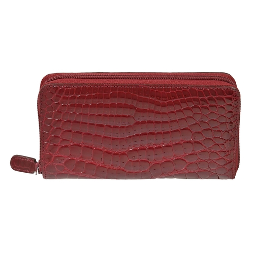 719 - A ladies Di Croco Australian saltwater crocodile hide purse, 20cm diam, in original cloth pouch and ... 