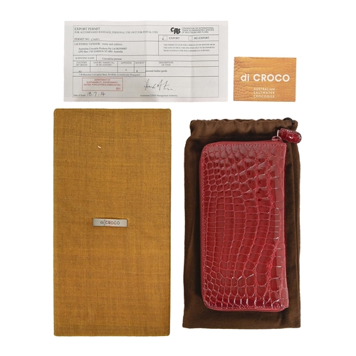 719 - A ladies Di Croco Australian saltwater crocodile hide purse, 20cm diam, in original cloth pouch and ... 