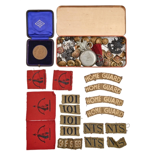 762 - Miscellaneous military items, to include regimental brass tunic buttons, cloth insignia for the Home... 