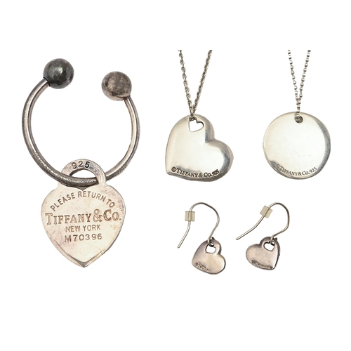 79 - Tiffany & Co.  Four silver articles,  comprising heart shaped and round pendants, pair of earrin... 