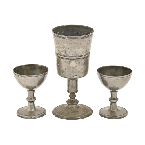 829 - An English pewter chalice, 18th/early 19th c,  with reeded girdle, 21.5cm h and a pair of Victo... 