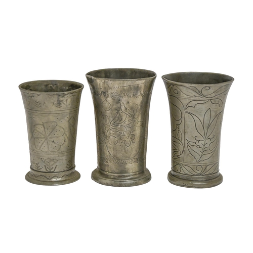 840 - Three German pewter beakers, 18th and early 19pth c, engraved with birds and/or stylised flower... 