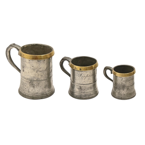 847 - Three English graduated brass rimmed pewter measures, 19th c,  9-14.5cm h, verification st... 