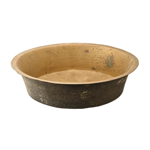 858 - An English sheet brass pan or bowl, 18ths/early 19th c,  69cm diam