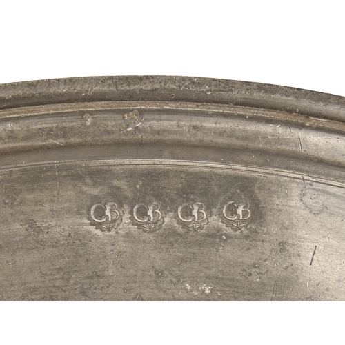 859 - Three English pewter charges, late 18th c and later,  46 and 51.5cm diam