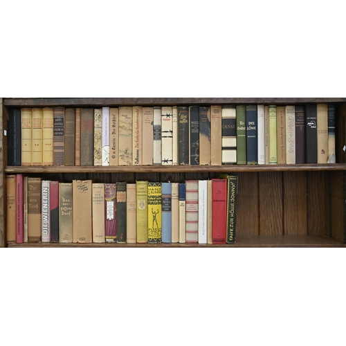 985 - Books. Eight shelves of German works, late 19th c and later, including an atlas, a facsimile of the ... 