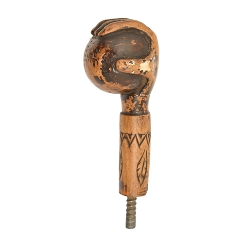 822 - An American carved and stained wood walking cane handle, early 20th c, in the form of a hand holding... 