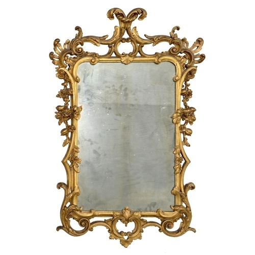 1120 - A George III giltwood mirror, c1760, of C scrolls and scrolling foliage, volutes, rocaille and penda... 