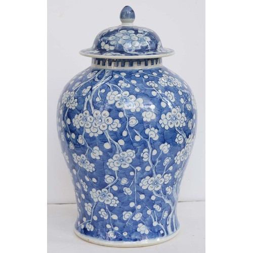 390 - A Chinese blue and white ginger jar and a cover, 19th c, painted with prunus on a cracked ice ground... 