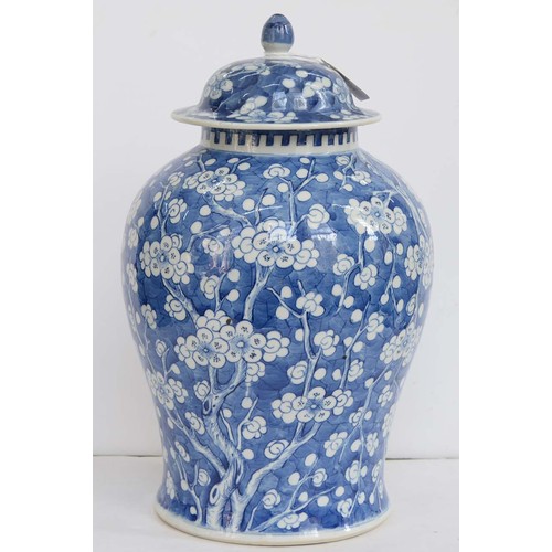 390 - A Chinese blue and white ginger jar and a cover, 19th c, painted with prunus on a cracked ice ground... 