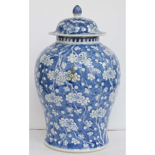 390 - A Chinese blue and white ginger jar and a cover, 19th c, painted with prunus on a cracked ice ground... 