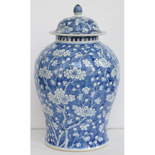 390 - A Chinese blue and white ginger jar and a cover, 19th c, painted with prunus on a cracked ice ground... 