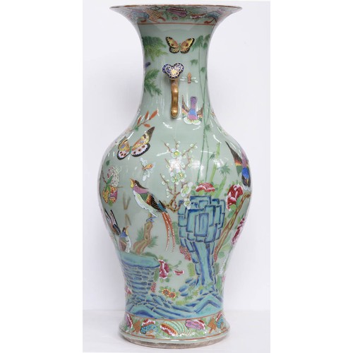 447 - A pair of Chinese celadon ground Canton famille rose vases, second half 19th c, with ruyi sceptre ha... 