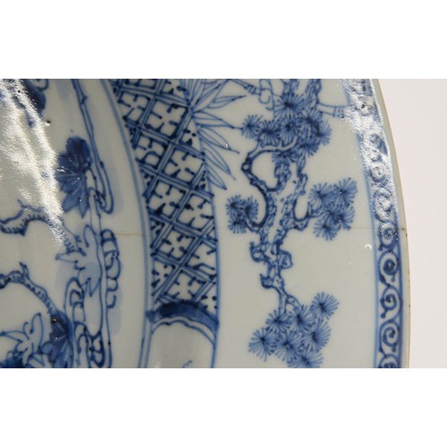 472 - A Chinese export blue and white charger, 18th c, painted with auspicious objects beneath a maple tre... 