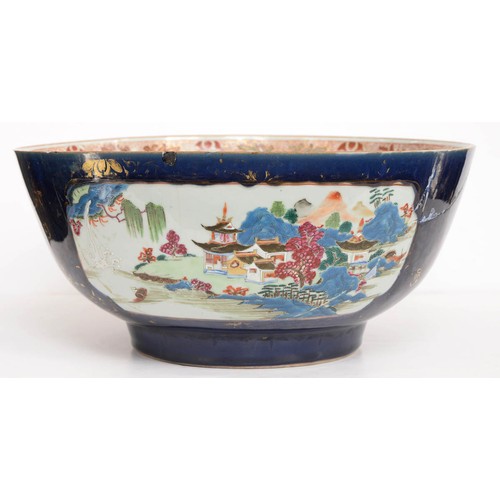 482 - A Chinese porcelain export famille rose punch bowl, 18th c, painted with scenes reserved on a gilt c... 