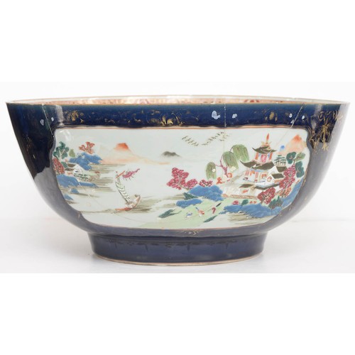 482 - A Chinese porcelain export famille rose punch bowl, 18th c, painted with scenes reserved on a gilt c... 