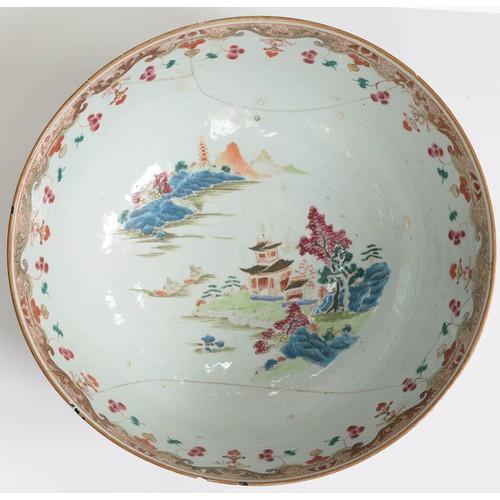 482 - A Chinese porcelain export famille rose punch bowl, 18th c, painted with scenes reserved on a gilt c... 