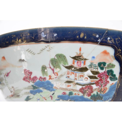 482 - A Chinese porcelain export famille rose punch bowl, 18th c, painted with scenes reserved on a gilt c... 