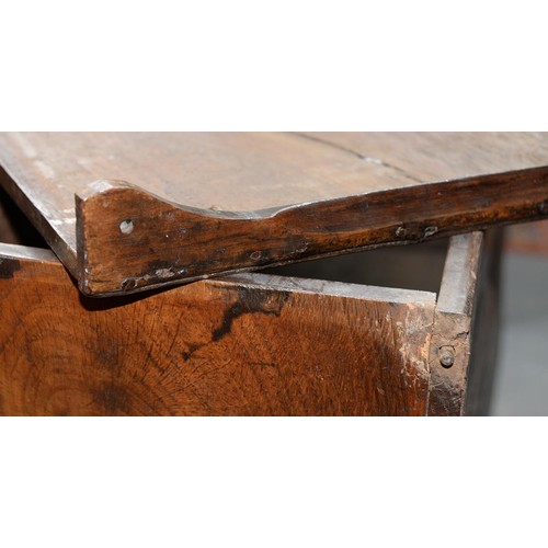 1194 - An oak coffr bach, late 18th/early 19th c, the front with break arched, raised and fielded panels ab... 