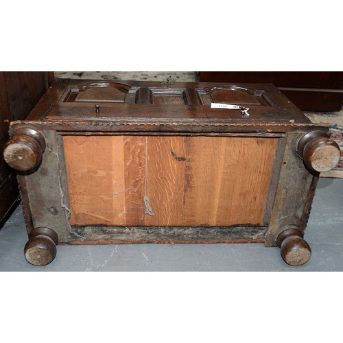 1194 - An oak coffr bach, late 18th/early 19th c, the front with break arched, raised and fielded panels ab... 