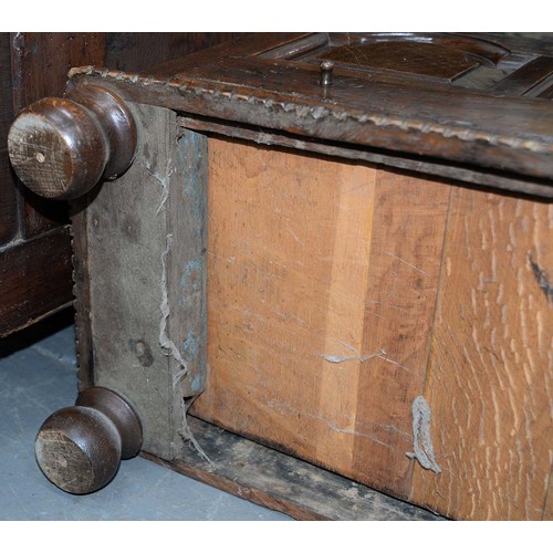 1194 - An oak coffr bach, late 18th/early 19th c, the front with break arched, raised and fielded panels ab... 