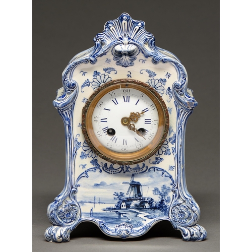 232 - A Dutch delft blue and white porcelain mantle clock, c.1900, moulded with shells and flowers, painte... 